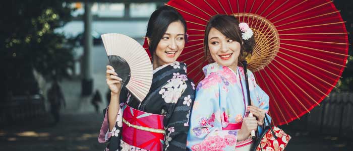 two Japanese girls wearing kimono