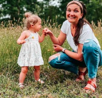 Brittany Mullins playing with daughter