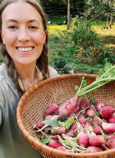 McKel Kooienga carrying a basket of radish