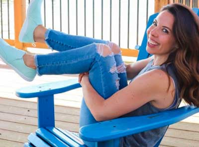 brittany dixon sitting on a blue chair