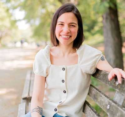 gena hamshaw sitting on a park bench