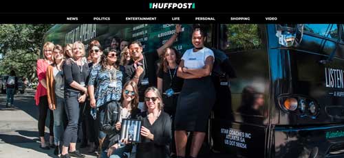 Girls behind HuffPost standing next to a bus