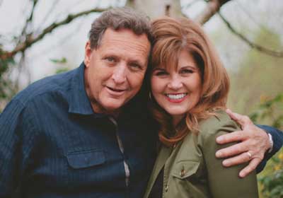 man and woman posing for the camera