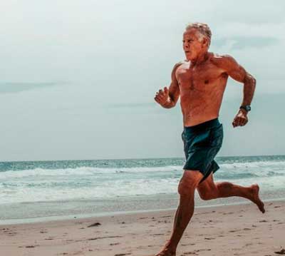 Mark Sisson running on the beach