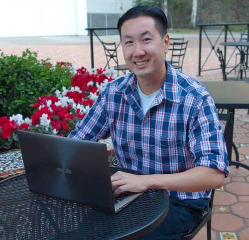 steve chou on his laptop sitting down at a cafe