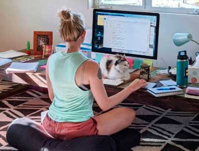 the founder of clean food dirtiy girl working on her computer